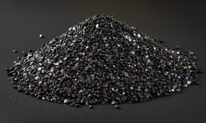Pile of dark granules mineral fuel and raw industrial material