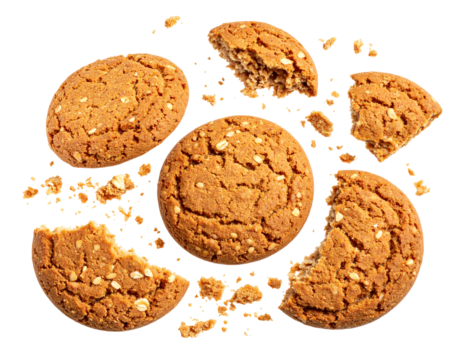 Crumbled oatmeal cookies, scattered pieces, golden brown, textured surface, sweet treat