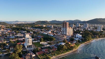 First light touches the ocean as the day begins &mdash; golden skies, calm seas, and nature in perfect balance along the Brazilian coast.