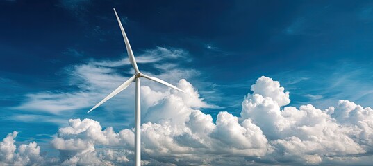 A single wind turbine stands tall against a vibrant blue sky dotted with fluffy cumulus clouds, showcasing clean energy potential