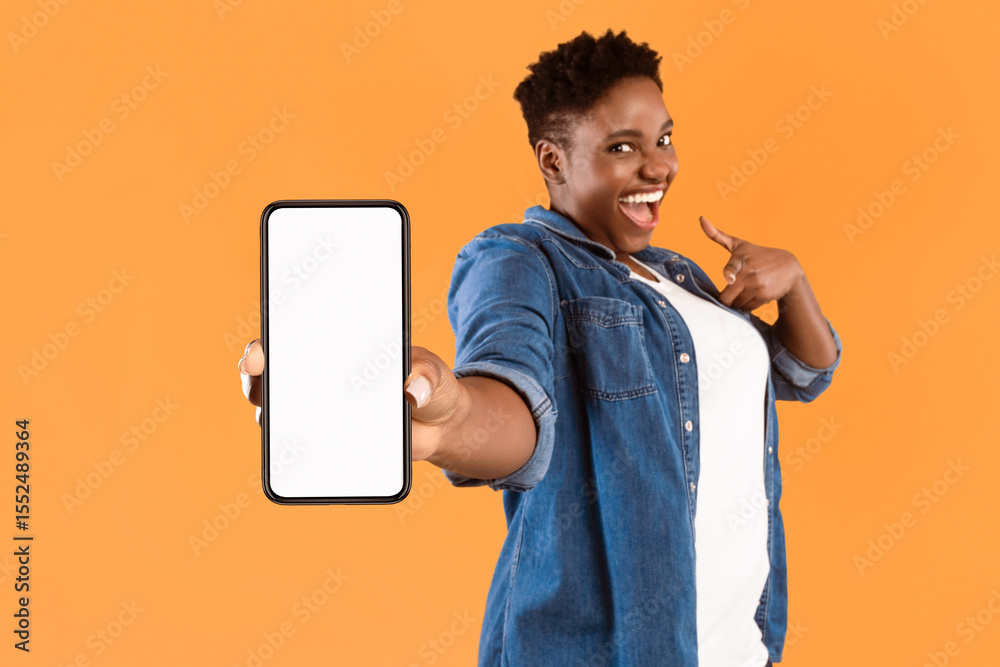 Poster mobile application ad. excited african woman showing phone empty screen recommending app standing ov