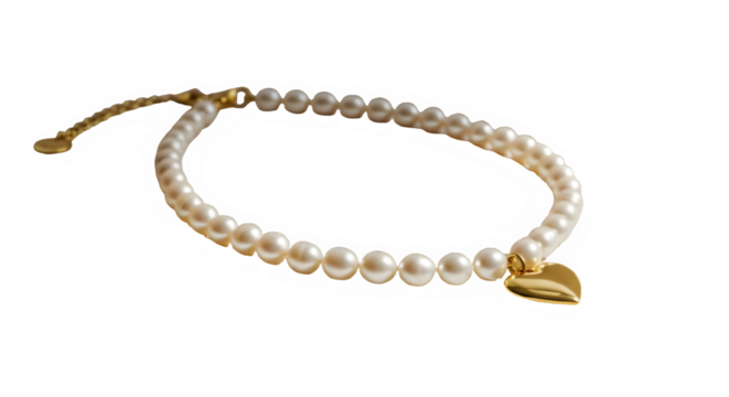 A pearl necklace with a gold heart charm on isolated white background.