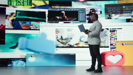 Joyful man using streaming services on laptop, receiving personalized video recommendations. Upbeat user using notebook, enjoying access to wide variety of online clips, camera A - Powered by Adobe