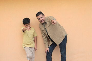 Single dad enjoys playing with his 10-year-old dark-skinned Latino son and spending time together...
