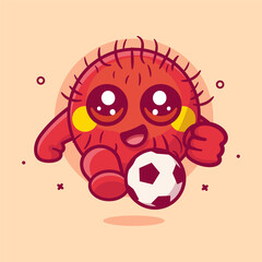 cheerful rambutan fruit character mascot playing football isolated cartoon