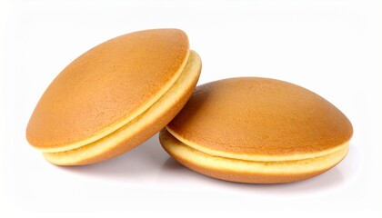 Whole and halved Japanese Dorayaki on white background close up 