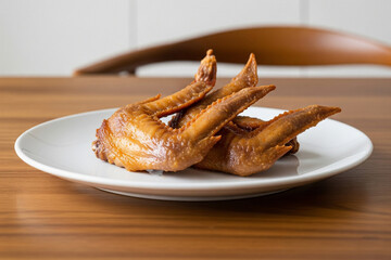 A modern minimalist food photo showcasing perfectly crispy duck wings, artfully arranged on a pristine white plate
