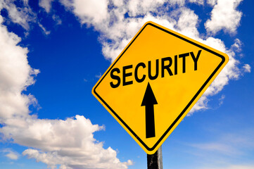 yellow Security  road sign with clouds