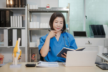 A middle-aged Asian female doctor at her desk,explaining various bone and joint diseases like...