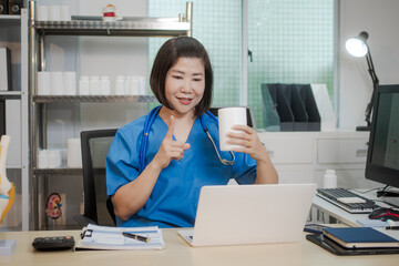 A middle-aged Asian female doctor at her desk,explaining various bone and joint diseases like...