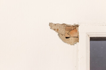 Close Up Of Chipped Wall Showing The Inner Construction Of Brick And Mortar