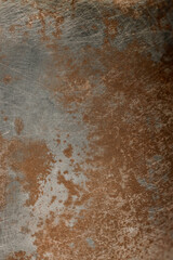 Close Up Of Weathered Metal Surface Combining Rusted Brown Patches With Silver