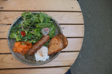 Delicious healthy meal featuring greens and a poached egg