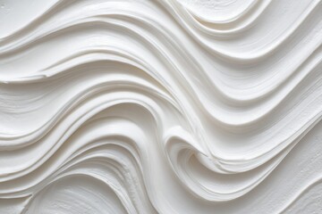 Obraz premium Abstract image of swirling, creamy white substance, creating a smooth, flowing texture with varying levels of depth and light
