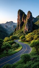Fototapeta premium Winding road through mountains at dawn