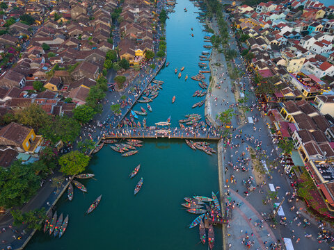 Aerial view of Hoi An old town or Hoian ancient town in evening. Royalty high-quality free stock image top of Hoai river and boat tour night traffic. One of the most popular touristic destination