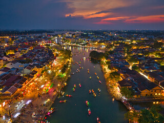 Aerial view of Hoi An old town or Hoian ancient town in evening. Royalty high-quality free stock image top of Hoai river and boat tour night traffic. One of the most popular touristic destination