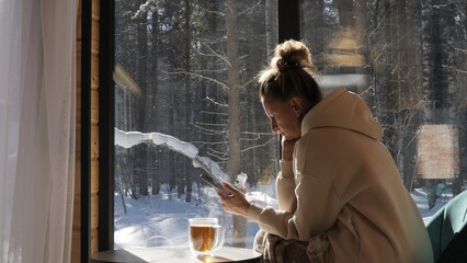 Minimalist moment in hut where mindfulness meets mobile connection Forest light fills space forest...