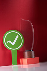 green circle with check mark and crystal trophy