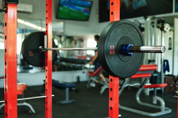 Close-up view of dumbbells, black circular weights, in a gym. 10-kilogram weight. View of weights in a gym.
