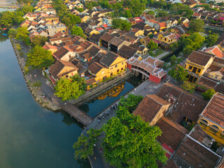 Aerial view of the Japanese Covered Bridge in Hoi An, Vietnam. Captures ancient architecture, tiled rooftops, and peaceful streets. Ideal for travel, tourism, culture, and heritage content