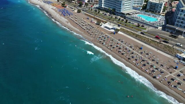 Aerial view of people swimming at the Akti Kanari Beach of Rhodes city, Greece