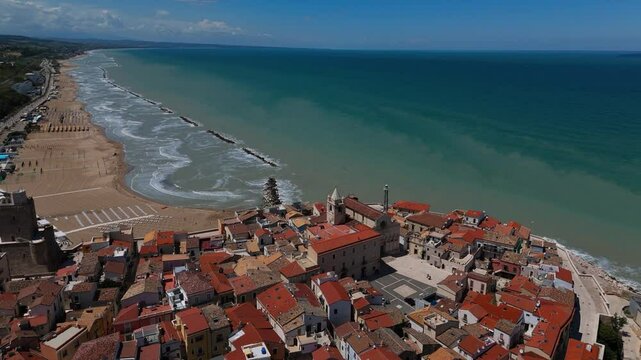 Aerial shot of Termoli old town square, cathedral and fortifies medieval walls. Italy seaside beach.