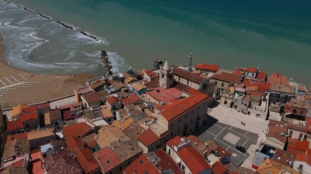 Aerial view of Termoli, Italy with beaches, historic town, churches, piazza and seaside beach life