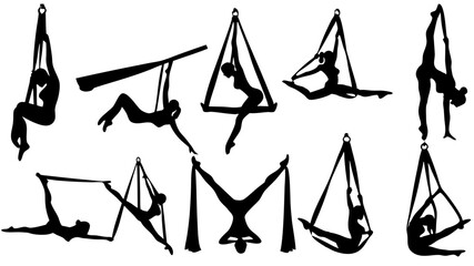 Silhouette of aerialist performers doing various poses on aerial silks and aerial hoops artfully displayed