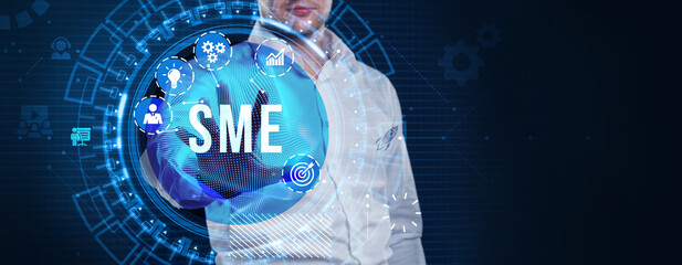 Business, technology, internet and network concept. Virtual screen of the future and sees the inscription: SME.