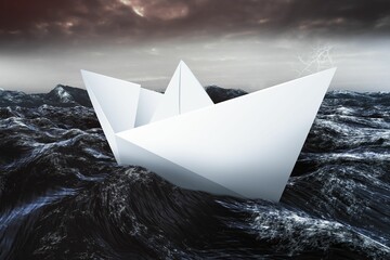 Paper boat floating on the sea