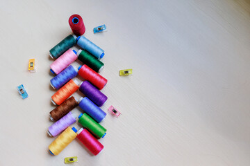 Christmas tree made of multi-colored thread spools. Christmas concept.