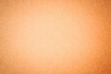 Coarse orange textured surface is filling entire frame in flat design style with subtle gradient