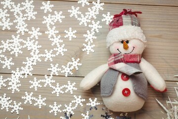 Overhead view of snowman by snowflakes