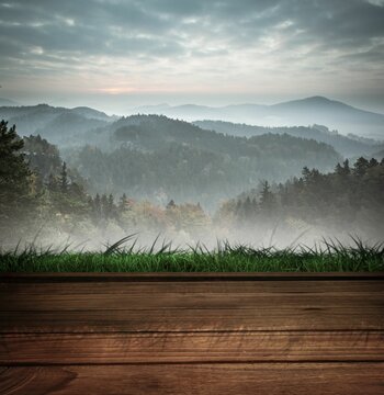 Fototapeta Wooden planks against mountains