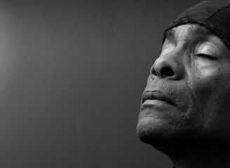 Praying to God with black background stock image stock photo