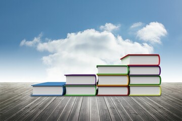 Flat design hardcover book stacks are forming ascending staircase on wooden deck under blue sky
