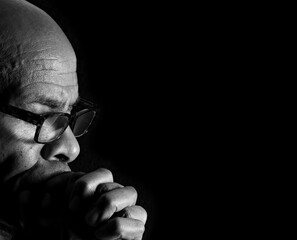 Praying to God with black background stock image stock photo