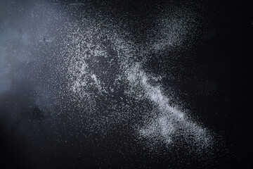 Scattered Sea Salt on Dark Surface