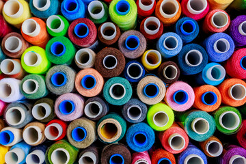 set of multi-colored spools of thread for sewing close-up