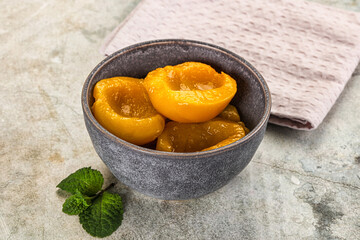 Canned marinated peach in syrop