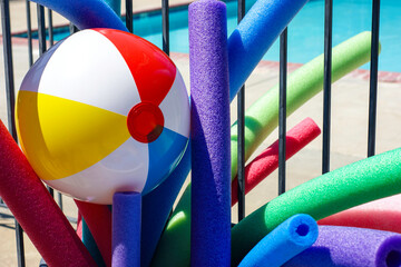 Close-up of colorful pool toys and beach ball