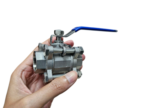 Stainless steel ball valve held in hand, showcasing plumbing components for engineering, mechanical tools, or industrial catalog use. Isolated on white background, transparent PNG