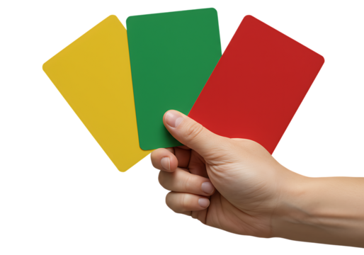 Hand holding three colored cards symbolizing stop, warning, and go against a black background
