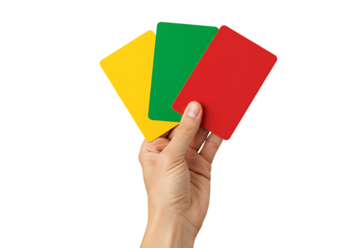 A hand holding football cards in three colors of yellow green and red against black