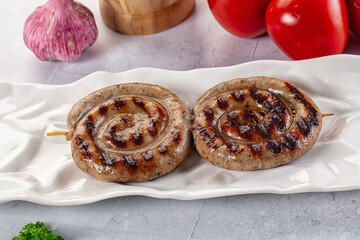 Grilled beef round circle sausages