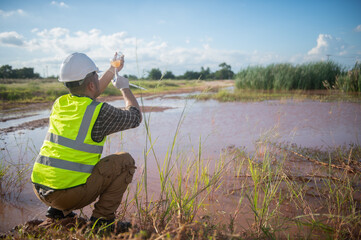 An environmental engineer examines the abundance of natural water sources and ecosystems