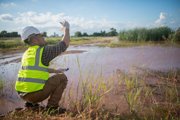 An environmental engineer examines the abundance of natural water sources and ecosystems