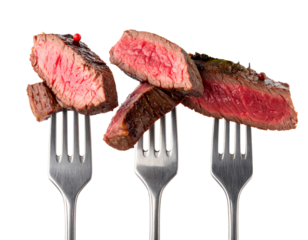 Slices of beef steak on vintage fork Isolated on Transparent or White Background