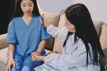 Doctor reassuring patient woman while sitting at the desk in clinic, just hands. Medicine and best...